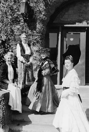 Library staff in period costumes