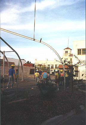 Workers assemble the temporary pavilions