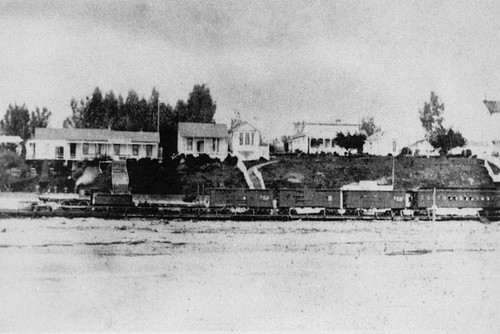 Railroad train on the beachfront, after line was broad-gauged