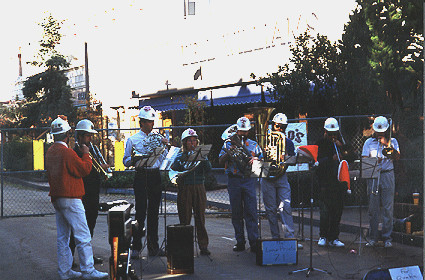 Hard hat brass band performs for the holiday parade