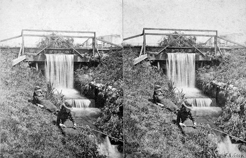 Two girls by a trout stream