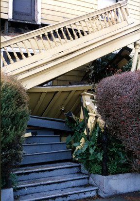 Fallen balcony on house at the corner of Elm Street and Center Street