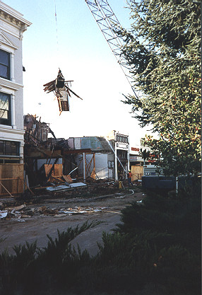 Crane is used to demolish and remove debris