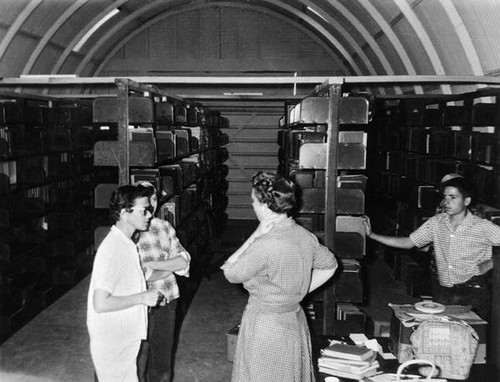 Library staff in a Quonset hut