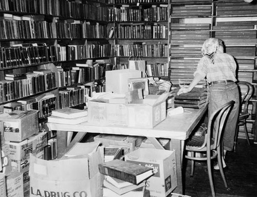 Laura Cardiff packing periodicals in the Santa Cruz Carnegie (Main) Library