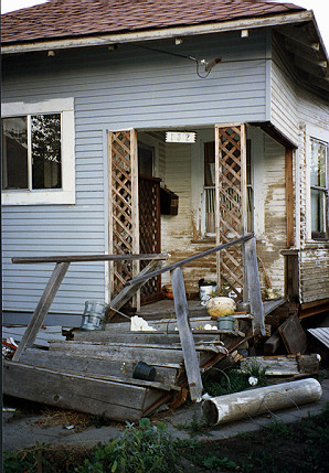 Earthquake-damaged porch and stairs