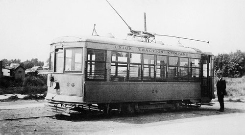 Conductor(?) standing next to streetcar No. 24 of the Union Traction Company