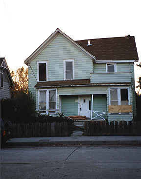 Chimney, roof, porch, and window damage