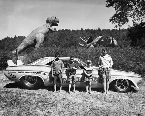 Thompson family children with "Jack Hagemann, Jr." race car at Lost World