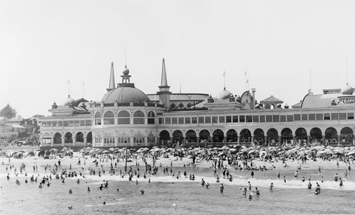 Swimmers and sunbathers on the beach by the Santa Cruz Beach Boardwalk and Casino