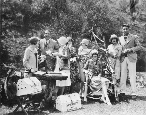 Actors from "Don't Marry" with carrier pigeon crates