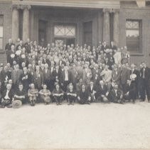 Men on steps of the Carnegie Library