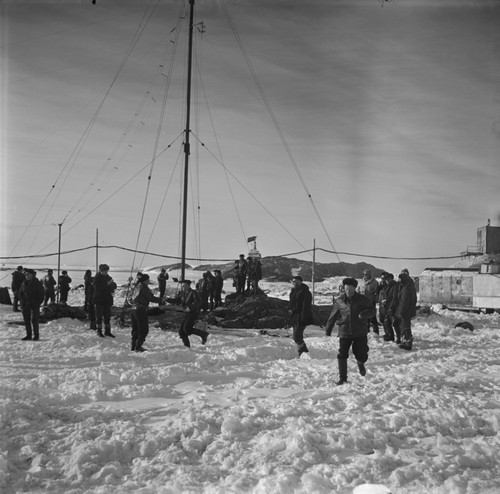 11th anniversary celebration of the official opening of Mirny Station, with station personnel around the wireless mast