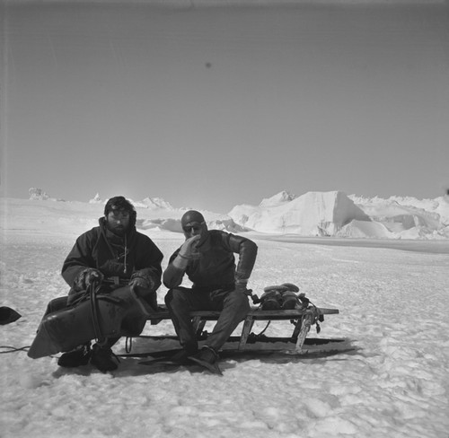 Divers Alexander F. Pushkin (left) and Eugene N. Gruzov (right), resting on the sledge between dives