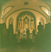 Raul Felix and Diana Guerrero at the alter on their wedding day, East Los Angeles, California