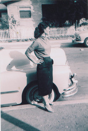 Ernestina Martinez in front of a 1948 Pontiac, East Los Angeles, California