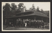 Group in front of Muir Woods Inn, with dog on hind legs