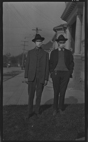 Two men wearing masks