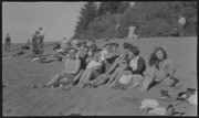 Large group sitting on the beach