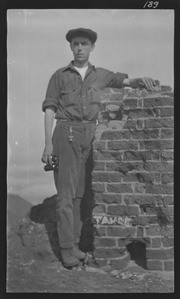 Raymond Coyne, leaning on brick wall at Mt. Diablo