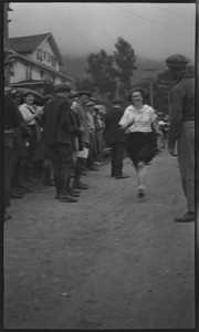 Woman crossing finish line