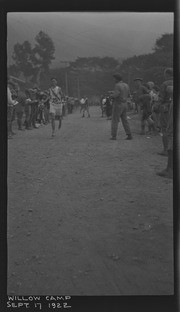 Male runner number 25 crossing finish line