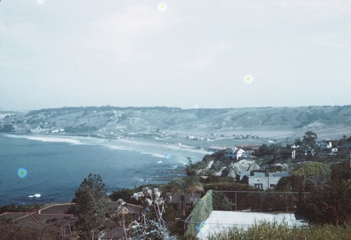 The view of La Jolla Shores beach and coastline towards Scripps Institution of Oceanography from a hill top in La Jolla, California. February 1945