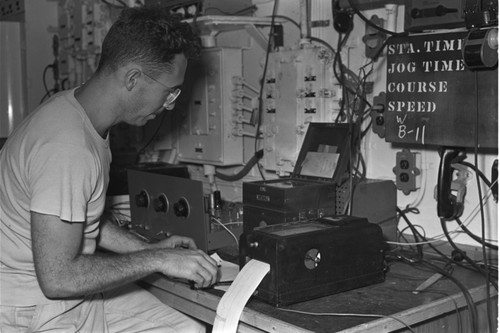 [Man with instruments in lab on R/V Spencer F. Baird]