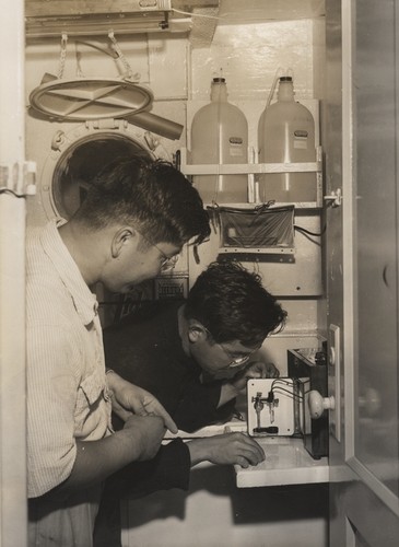 Richard Morita of Scripps Institution of Oceanography and Claude ZoBell's student, and Noriyuki Nasu, doing bacteriological work on the R/VSpencer F. Baird. Transpac Expedition. 1953