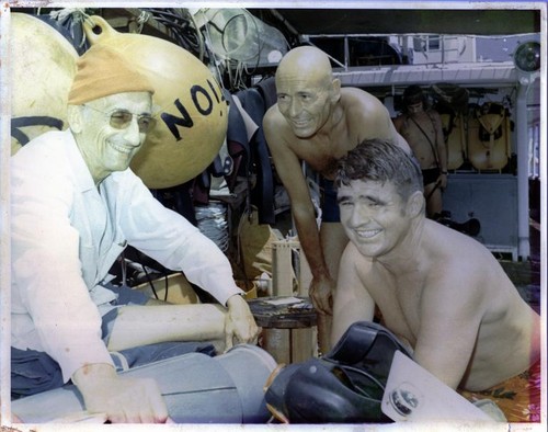 Jacques Yves Cousteau (left), diving researcher and artist André Laban (center) and Scripps Institution of Oceanography scientist and diver Robert Floyd Dill (right) aboard Cousteau's ship Calypso. Circa 1959