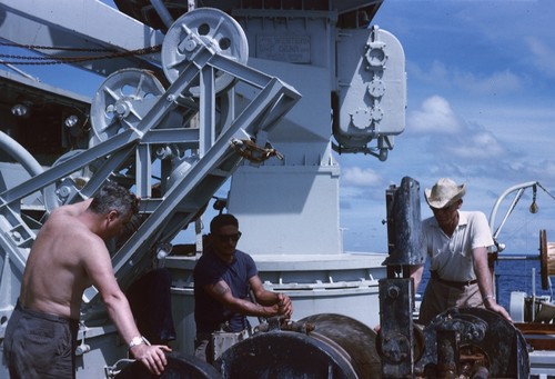 Unidentified scientists during the Lusiad Expedition (1962-63) shown here on the research ship Argo. This expedition was an international effort to explore the Indian Ocean. On this expedition, the Scripps Institution of Oceanography research vessels Horizon and Argo sailed around the world to study the Indian Ocean, its currents and map its seafloor. Circa 1963