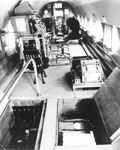 In 1962 Applied Oceanography Group (AOG) at Scripps Institution of Oceanography leased this DC-3 airplane. This photo shows the inside main cabin view of the aircraft. Later the plane would be given to them for continued research; AOG then mounted a infrared radiometer to measure heat flow from the ocean in the plane. With the airplane it was possible to survey 10,000 square miles of sea surface in 24 hours. Circa 1965