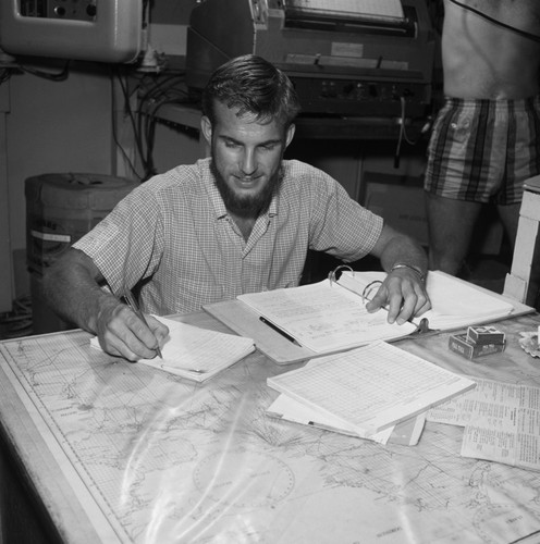 [Oceanographer with map and cigarettes]