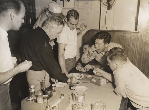 Eating Squid, From Left: John Cochrane, unidentified crew member (dark shirt), Capt. Vernon Wyatt (baseball cap), Alan Smith, John McGowan, Minoru Kiode, Bob Gilkey