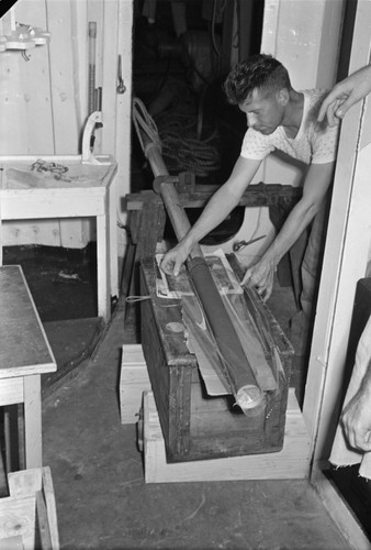 [Man with drill core R/V Spencer F. Baird]