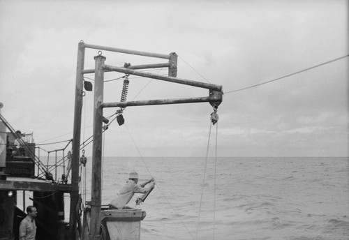 [Man with Nansen bottle on wire, R/V HORIZON]