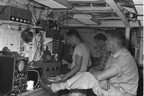 [Men with instruments in lab on R/V Spencer F. Baird ]