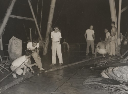 Rigging piston corer. From Left: N. Nasu, Japanese biologist, Japanese biologist, Warren Wooster, Dick Morita, Minoru Koide, Bob Fisher