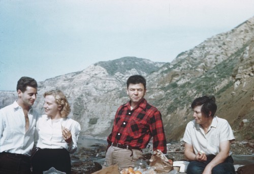 Left to right; unidentified man, Elizabeth M. Kampa , Carl L. Hubbs, ichthyologist at Scripps and his wife Laura C. Hubbs, on the beach at the Institution. February 1945