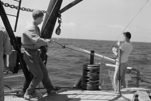 [Men with sonabuoy on deck of R/V Spencer F. Baird]