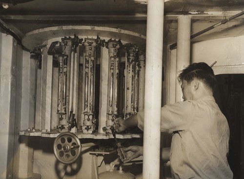 Minoru Koide drawing water samples for Oxygen analysis