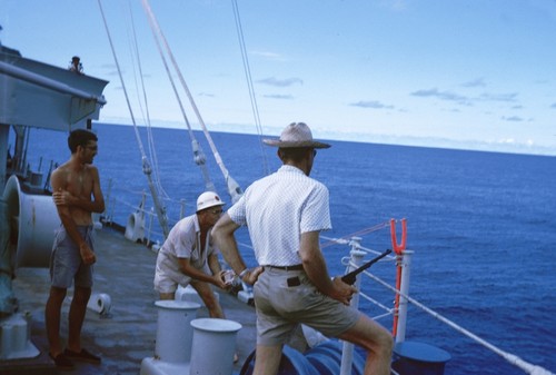 Unidentified scientist are shown here skeet shooting for some fun, on the research ship Argo during the Lusiad Expedition (1962-63). This expedition was an international effort to explore the Indian Ocean. On this expedition, the Scripps Institution of Oceanography research vessels Horizon and Argo sailed around the world to study the Indian Ocean, its currents and map its seafloor. Circa 1963