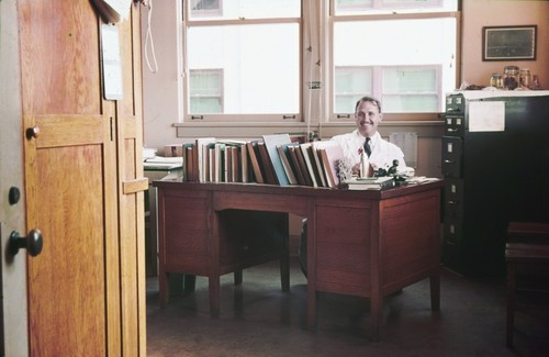 Denis Llewellyn Fox in his office. Fox was a professor of Marine Biochemistry at Scripps Institution of Oceanography. Circa 1938