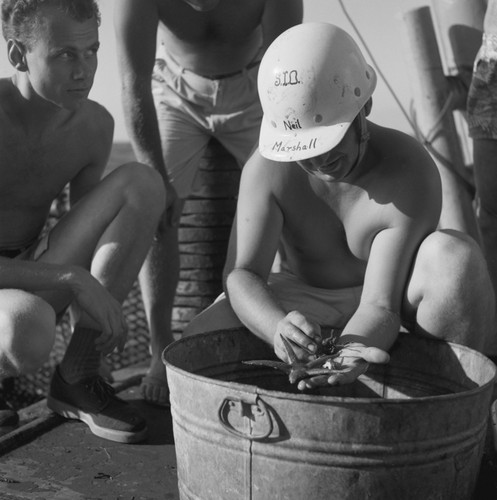 [Neil Marshall examining dredge haul]