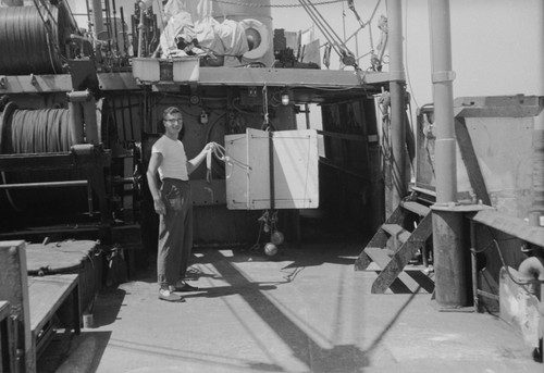 [John Knauss with oceanographic instrument aboard R/V HORIZON]