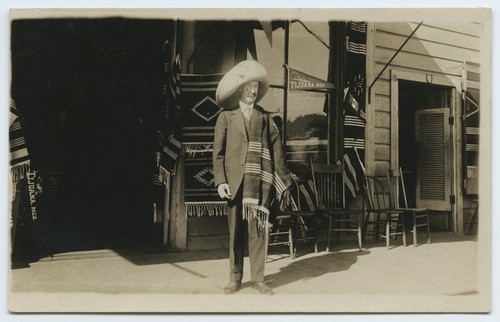 Tourist in Mexican costume near U.S.-Mexico border station