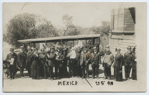 Tijuana visitors near tour bus