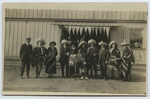 Tourists in Mexican costume with donkey, Tijuana, Mexico