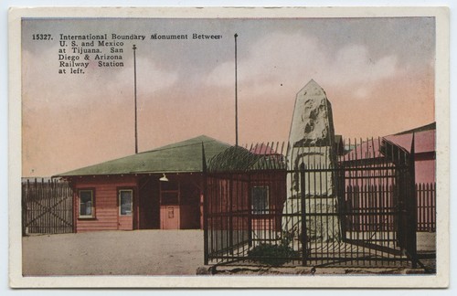 International boundary monument between U.S. and Mexico at Tijuana. San Diego & Arizona Railway Station at left