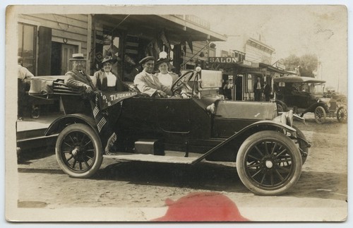 Automobile passengers with Tijuana, Mex. pennant